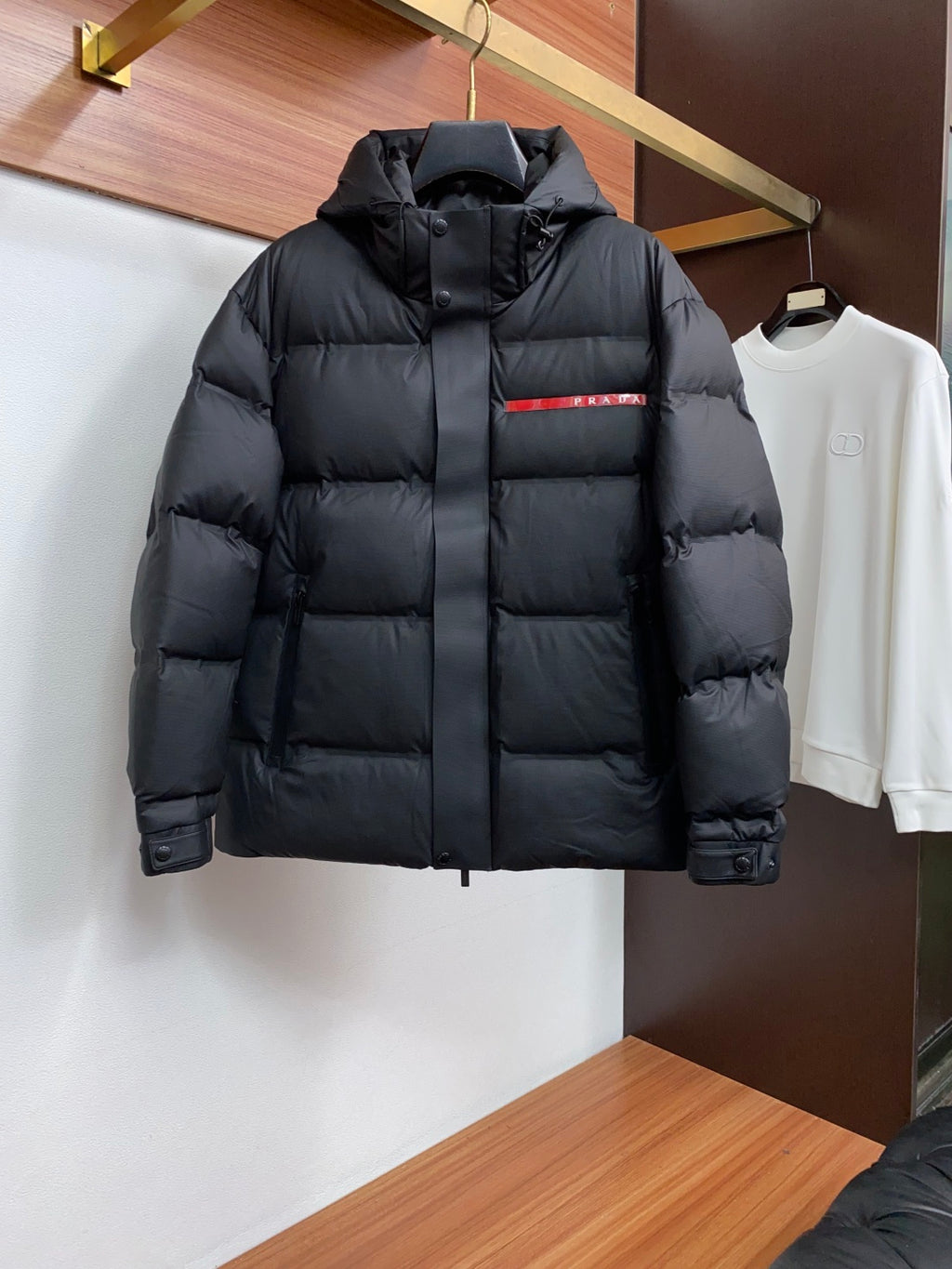 PRADA Black Hooded Down Jacket | Signature Red Accent & Modern Cold-Weather Style
