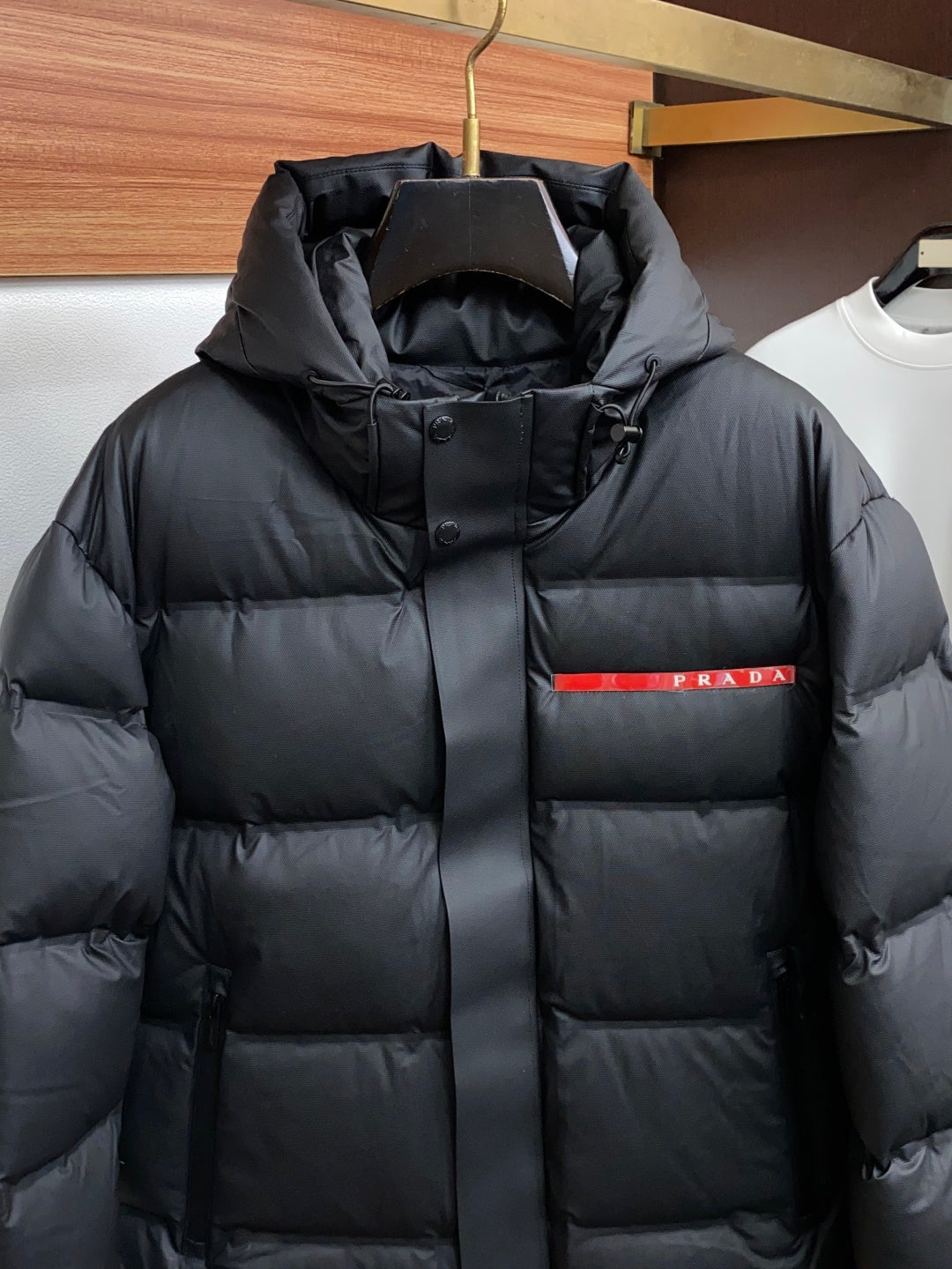 PRADA Black Hooded Down Jacket | Signature Red Accent & Modern Cold-Weather Style