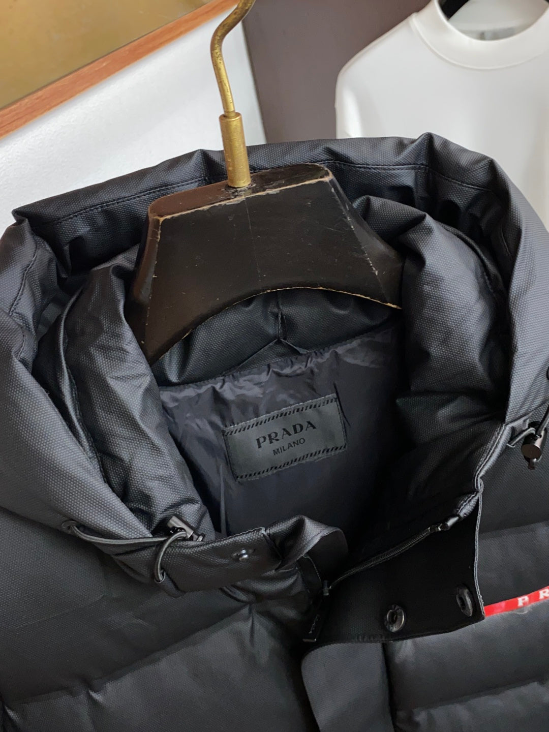 PRADA Black Hooded Down Jacket | Signature Red Accent & Modern Cold-Weather Style