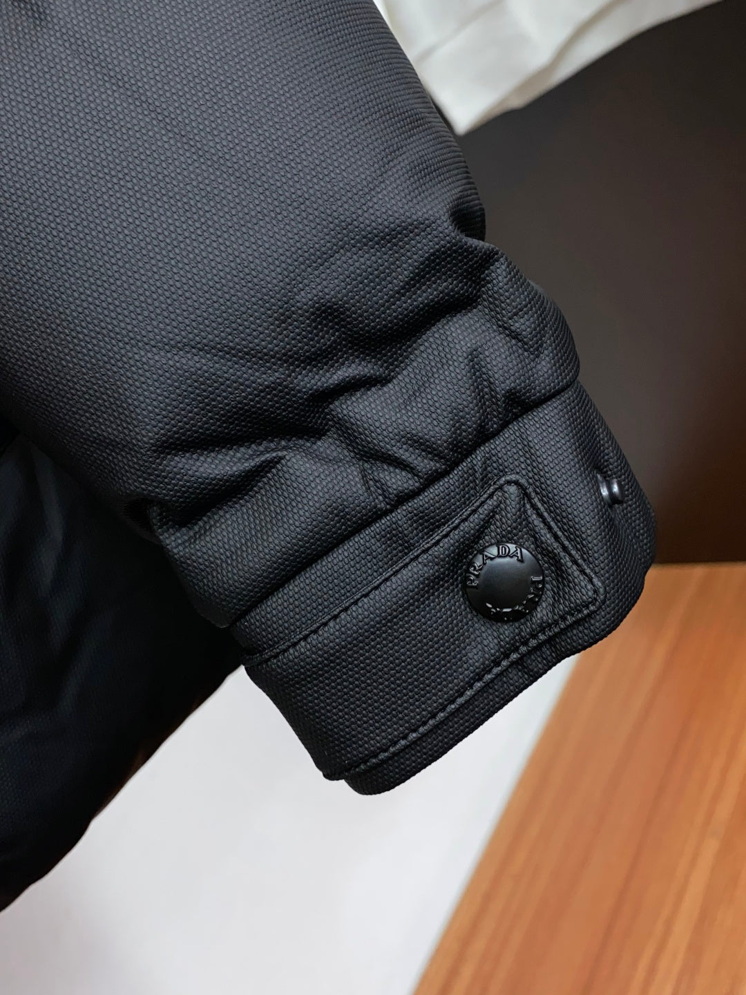 PRADA Black Hooded Down Jacket | Signature Red Accent & Modern Cold-Weather Style