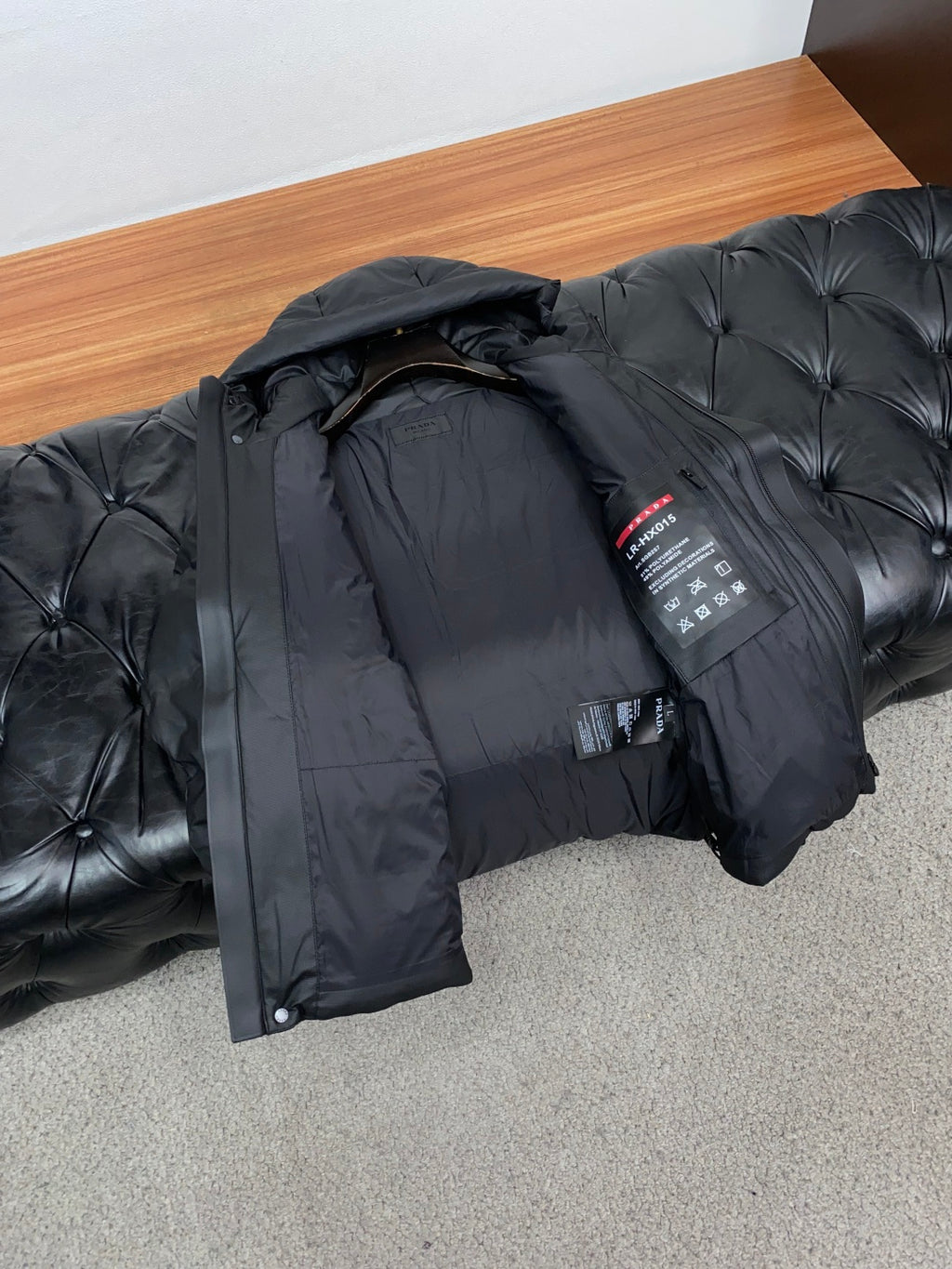 PRADA Black Hooded Down Jacket | Signature Red Accent & Modern Cold-Weather Style